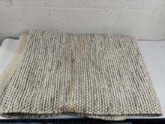 A pre-owned rug, approximately 230 x 150cm (sold as seen).