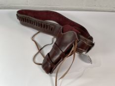 A leather holster with ammo belt from White Pigeon Online Leather Depot.