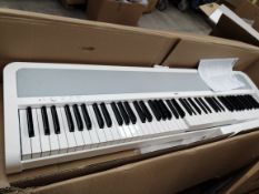 A Korg B2SP digital piano with some damage (sold as seen).