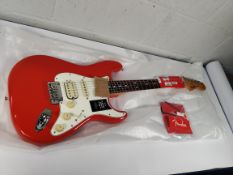 An as new Fender Player II Stratocaster HSS, rosewood fingerboard, Coral Red.