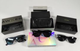 Five assorted as new Hawkers items; 3 pairs of sunglasses, a cleaning kit and flip case.
