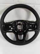 A pre-owned Land Rover steering wheel.