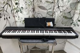 A pre-owned Yamaha P-125 digital piano (sold as seen).