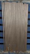 Twenty four stainless steel solid round rods - grade 310, approximately 100 x 2cm.
