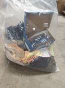 A bag of as new clothing and trainers with tags to include Adidas Spezials, Nike hoodie and Boss soc