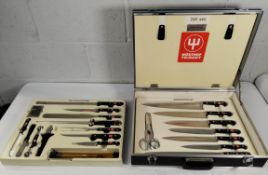 A lockable cooks set in case - twenty seven utensils to include knives, sharpener, spatula and balle