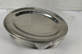 Eighteen stainless steel oval dishes, flat - 355mm (may show signs of long term storage).