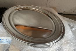 Eighteen stainless steel oval dishes, flat 553mm (may show signs of long term storage).
