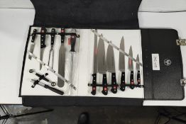 A lockable cooks set in case - thirteen utensils to include knives, sharpener, spatula and ballers (