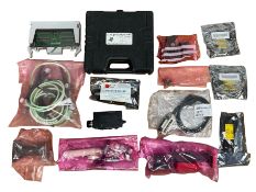 Pre-owned electronic test kit including Flann components.