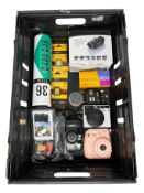 Assorted cameras and related items.