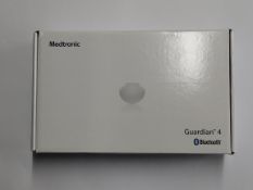 An as new Medtronic Guardian 4 Transmitter Kit (REF: MMT-7840W1, Recharge By Date: 2025-04-02).