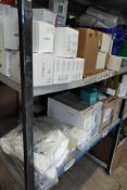 Two shelves of expired medical products and equipment. (Please note: these items have past their exp