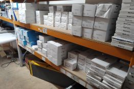 A large quantity of assorted Medtronic products (2 shelves).