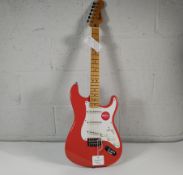 A Squier Classic Vibe 50s Stratocaster in Fiesta Red.