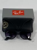 A pair of Ray-Bans Erika Classic sunglasses in matte rubber black and light grey gradient lenses (RB