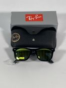 A pair of Ray-Bans Wayfarer Flash sunglasses in black with yellow mirror lenses (RB2140 901-18).