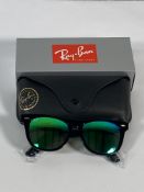 A pair of Ray-Bans Wayfarer Flash sunglasses in black with green mirror lenses (RB2140 901-19).