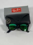 A pair of Ray-Bans Wayfarer Flash sunglasses in black with green mirror lenses (RB2140 901-19).