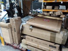 Assorted flatpack furniture and other household items.
