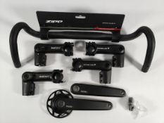 Six cycling related items - four Satori stems, one Zipp handle bar and a set of Ride+ crank arms.