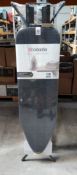 An as new Brabantia ironing board type B with steam iron rest, size 124 x 38cm, 7 height adjustment