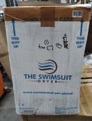 A Complete Leisure swimsuit dryer water extractor unit, box open.