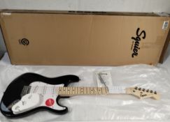 An as new Fender Squier Sonic Stratocaster MN WPG BLK electric guitar in black, white pick guard, ma