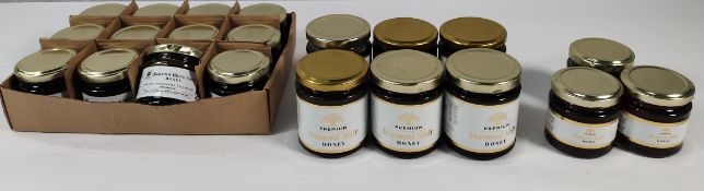 Twenty one assorted Prophetic Blends 100% organic raw honeys (some lids dented).