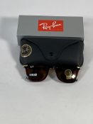 A pair of Ray-Bans Square sunglasses in brown with brown classic lenses (RB2148).