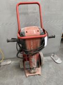 A pre-owned Hilti TE-3000 AVR heavy duty concrete breaker with trolley.