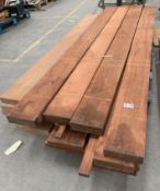 A pallet of assorted dark hard woods in various lengths and widths. We believe these include Iroko.