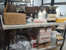 A large quantity of assorted dental, oral hygiene and other related products on two shelves.