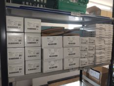 A large quantity of assorted Medtronic items on one shelf.