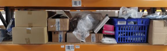 A large quantity of assorted braces, supports and related on one shelf.