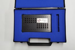 A Dynex Technologies Opsys MR Verification Plate.