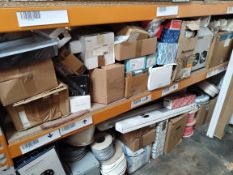 Two shelves of electrical and plumbing items.