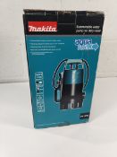 A boxed as new Makita electric submersible pump 1100W PF1010.