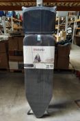 An as new Brabantia ironing board type C with solid steam unit holder, size 124 x 45cm, 7 height adj