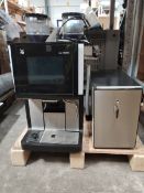 A pre-owned WMF1500S bean-to-cup coffee machine complete with milk fridge.