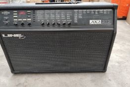 A pre-owned Line 6 AX2 212 guitar amp with some minor damage.