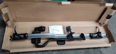 A Volvo roof mounted bicycle holder, boxed with manual (EMB6769808).