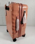 An as new Tumi Cabin Trolley 19 degree International Expandable 4 wheeled, pink clay, boxed (S139683