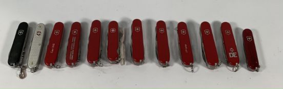 Twelve pre-owned Victorinox Swiss army penknives (over 18s only).