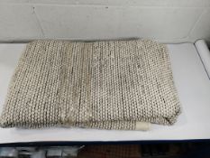 A pre-owned rug, approximately 230 x 150cm (sold as seen).