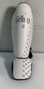 A pair of Fairtex SP5 Maui Thai shin guards, size L.