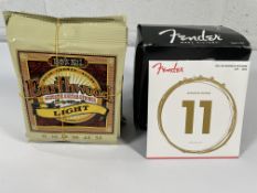 Ten sets of Ernie Ball Earthwood and eleven sets of Fender 80/20 Bronze acoustic guitar strings - li