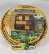 An as new Hozelock 30m starter hose set (72309).