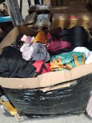 A pallet of assorted pre-owned clothing, shoes and clothing accessories.