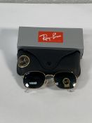 A pair of Ray-Bans Pillow sunglasses in polished gold with G-15 green classic lenses (RB3706).